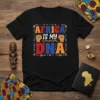 AFRICA IS MY DNA text design with African-inspired graphics and fist symbols on a black t-shirt