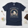 T-shirt design with "AFTERNOON TEA Sweet Moments & Good Company" text, featuring a cat at a tea table surrounded by