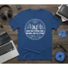 AI CODE THE FUTURE, ONE NEURAL NET AT A TIME quote on a blue t-shirt, featuring a circular design with