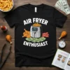 Air Fryer Enthusiast t-shirt design with text and cartoon graphics of an air fryer, fried chicken, bacon, and money