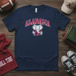 Navy blue t-shirt featuring the Alabama Crimson Tide elephant mascot with "ALABAMA" text above, holding a football