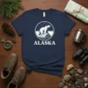 Alaska Polar Bear T-Shirt featuring a white polar bear on a rock under a starry sky with "ALASKA" text