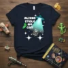 Aliens Stole My Cat text design with a cat astronaut being abducted by a UFO and an alien