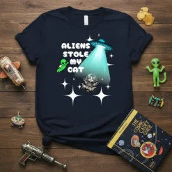 Aliens Stole My Cat text design with a cat astronaut being abducted by a UFO and an alien