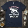 Navy blue t-shirt featuring white text "All Dogs Are Cool But Dogos Argentinos Rule" with an illustration of a white