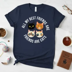All My Best Friends Are Friends Are Cats quote with four different cat faces graphic on a navy t-shirt