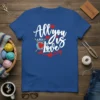 Blue t-shirt with white script text "All you Knit is Love" and knitting graphics, including heart and yarn