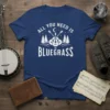 ALL YOU NEED IS BLUEGRASS t-shirt design with crossed acoustic guitars, pine trees, moon, and stars