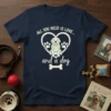 All You Need Is Love And A Dog graphic tee featuring a golden retriever inside a heart with paw prints