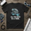 Robot turtle on a skateboard with text "ALL YOU NEED IS A TOOL" on a black t-shirt