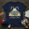 Navy t-shirt with "Alley Cat" text and a cartoon cat wearing a crown sleeping on a bowling lane with pins