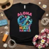 Aloha Maui Hawaii t-shirt design featuring a smiling sea turtle in ocean waves, with colorful text