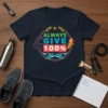 Always Give 100% text with muscle arm, sneakers, and upward arrow graphic on a navy blue t-shirt