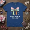 Always Tie One On Life's a Gift quote on a blue t-shirt with a pink, blue, and green bow graphic