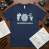 Ambidextrous t-shirt design with brain graphic, hands holding a pen and a wrench