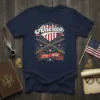 America 1776 * 2026 design on a navy t-shirt featuring crossed muskets, shield with American flag, and patriotic stars