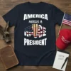 America Needs A Rude President t-shirt with Donald Trump's face behind bars and the American flag graphic