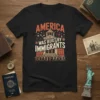 Black t-shirt with "AMERICA WAS BUILT BY IMMIGRANTS" text in retro font, featuring a depiction of a classic building and