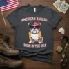 American Badass Born In The USA text with patriotic bulldog graphic on dark heather t-shirt