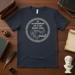 Quote "An Unexamined Life Is Not Worth Living" with ancient Greek-style bust and oil lamp graphic on a dark t-shirt