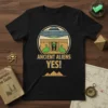 Ancient Aliens YES! text with alien and UFO graphic on a black t-shirt, pyramid design elements