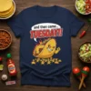 T-shirt with "and then came... TUESDAY!!" text and a cartoon taco character on fire leading smaller tacos