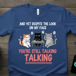 Three grumpy cats in a meeting, with text "AND YET DESPITE THE LOOK ON MY FACE YOU'RE STILL TALKING TALKING"