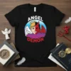 Angel Demon text with split face graphic, half angel half devil, on a black t-shirt
