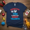Annoying YOU IS ONE OF MY MANY TALENTS quote on a navy blue t-shirt with a cartoon devil graphic
