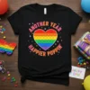 Black t-shirt with "Another Year Happier Poppin'" text and a rainbow Pop It heart graphic, celebrating birthdays