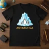 Antarctica t-shirt design with a family of penguins on an iceberg, featuring the text ANTARCTICA