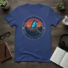 Antisocial Butterfly T-Shirt with a blue butterfly perched on a branch, set against a vintage sunset and forest graphic