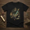 Anubis Egyptian God T-Shirt featuring the jackal-headed deity holding an ankh and staff, surrounded by hieroglyphics