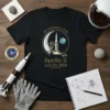 Black t-shirt design celebrating the Apollo 11 50th Anniversary July 20 1969 with Saturn V rocket, moon, and Earth graphic