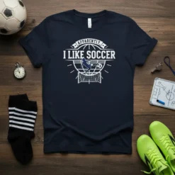 Apparently I Like Soccer t-shirt with graphic of soccer player kicking ball into net