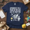 Apparently I'm a Pain in the Ass Ass to Shop For quote on a navy t-shirt with shopping cart graphic