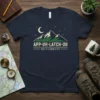 Navy t-shirt with "APP·UH·LATCH·UH SAY IT CORRECTLY" text and a mountain graphic under a moon and stars