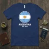Argentina Est. 1816 t-shirt design with a circular graphic of the Argentina map and flag, white text below
