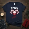 Navy blue t-shirt with "Aries girl" text and a red and white ram graphic, representing the Aries zodiac sign