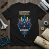 Black t-shirt with "ASCENSION PROTOCOL INITIATE SEQUENCE ACTIVATE" text and a vibrant abstract geometric graphic