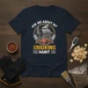 Ask Me About My Smoking Habit t-shirt featuring a graphic of a smoker grill, steak, and cleavers