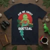 Ask Me About Quetzal text design with a vibrant green quetzal bird perched on a branch, set against a red
