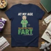 Funny "At My Age You Just Can't Trust A Fart" t-shirt design with an elderly man in pajamas looking surprised