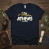 Navy blue t-shirt with the word ATHENS in bold yellow and white lettering, above a depiction of the Acropolis