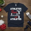 Athletes lift weights Cheerleaders lift Athletes quote on a navy t-shirt with cheerleaders and barbell graphics