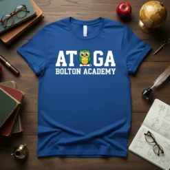 ATOGA BOLTON ACADEMY text with a cartoon owl holding a scroll on a royal blue t-shirt