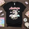Aunticorn text above a cartoon unicorn wearing sunglasses and jewelry on a black t-shirt