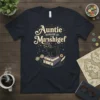 Auntie Manager of Manshigef text with a witchy black cat on books graphic, styled with stars and magical elements