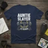 Auntie Slayer In Training t-shirt with barbell graphic and laurel wreath, designed for fitness enthusiasts and new aunties