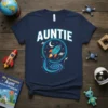 Navy blue t-shirt with the word "AUNTIE" in bold white letters above a graphic of a rocket ship flying through